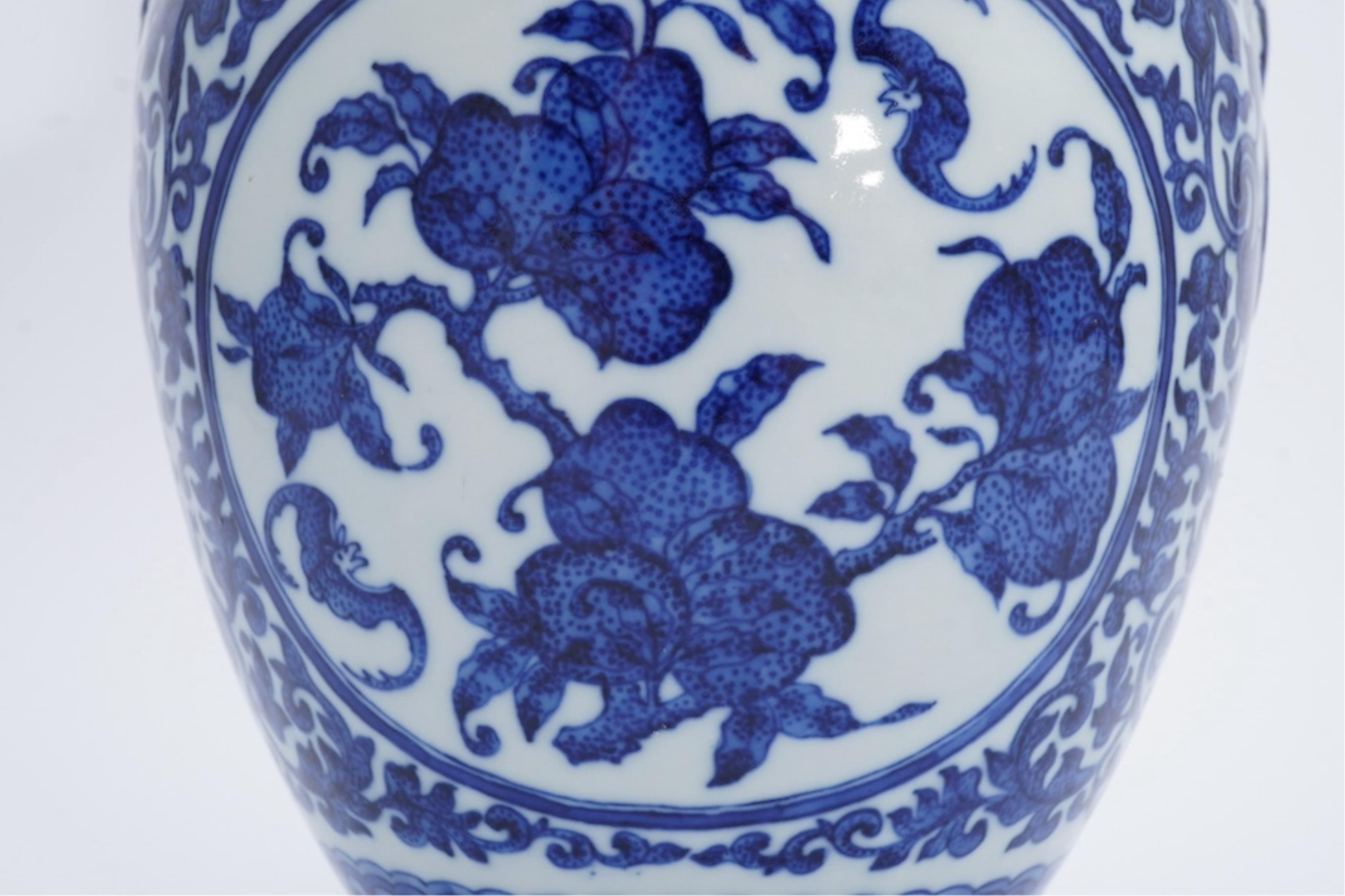 A Chinese blue and white 'peaches' vase, Qianlong mark but later, 27cm high. Condition - good